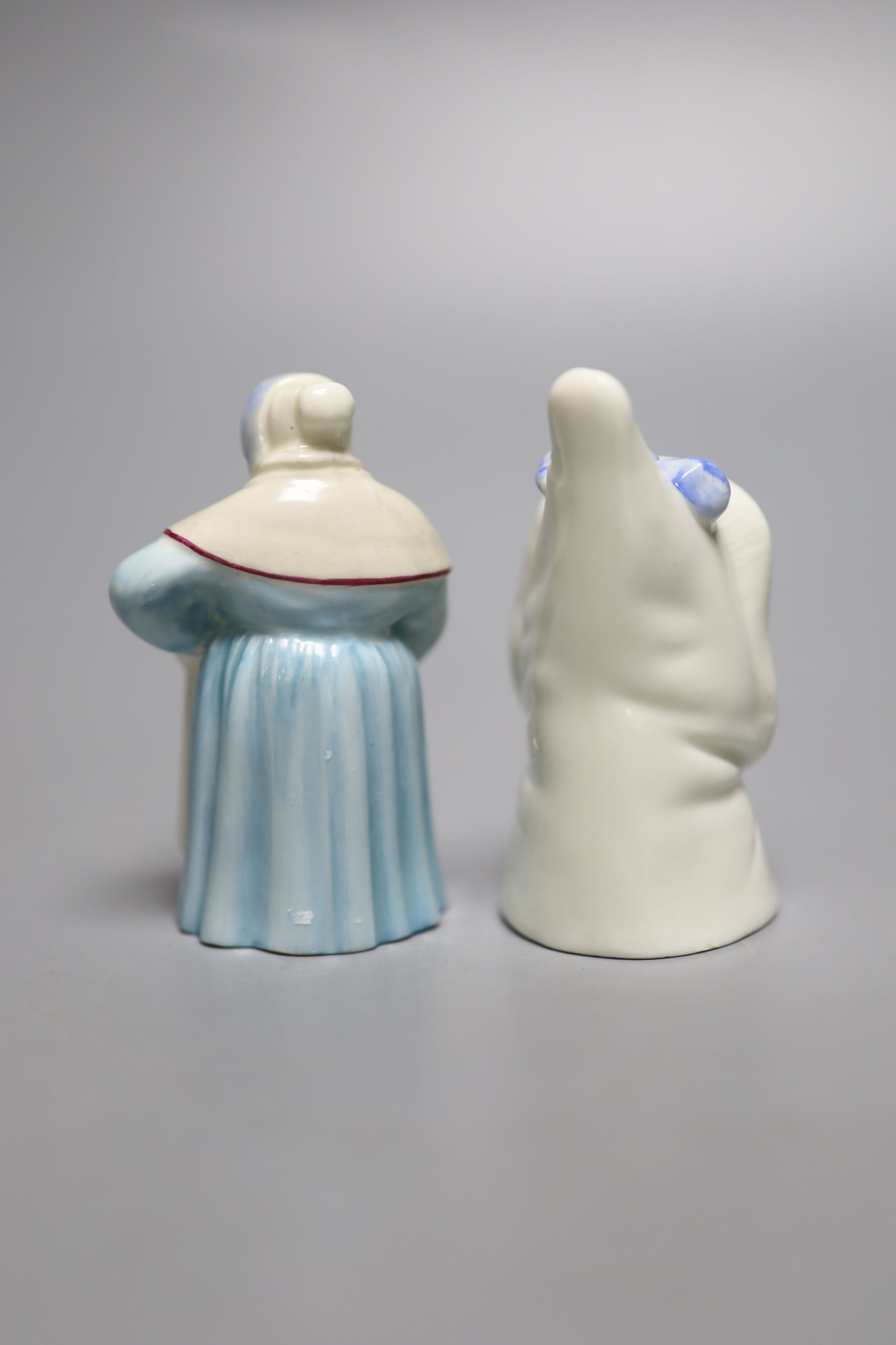 A Royal Worcester candlesnuffer of Mrs Caudle, date mark 1919 and a candlesnuffer of the French Cook, date mark 1925